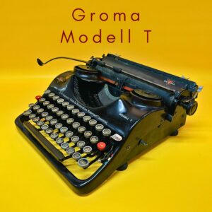Máquina de escribir Groma Modelo T en funcionamiento con estuche negro